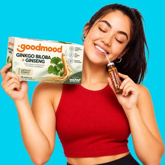 Woman with WOW! Nutrition ginkgo biloba and ginseng ampoules in pop-art composition, cyan background