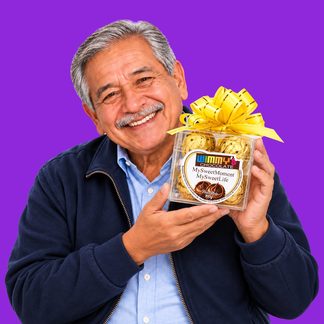 Grandfather with box of chocolates in pop-art composition, purple background
